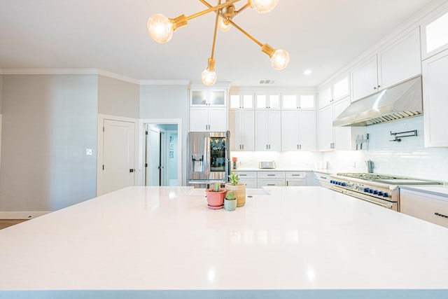 kitchen featuring under cabinet range hood, a spacious island, visible vents, appliances with stainless steel finishes, and decorative backsplash