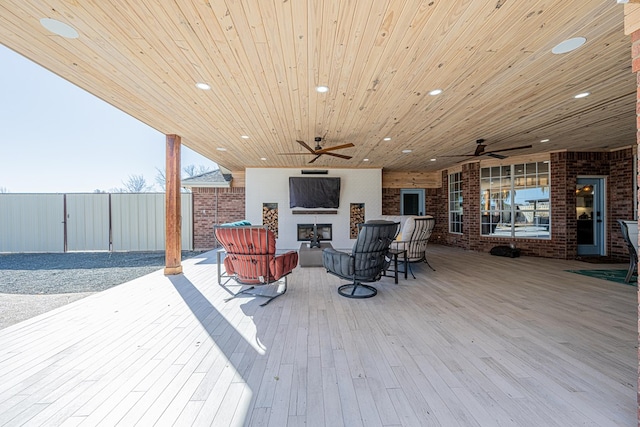 wooden terrace with a ceiling fan