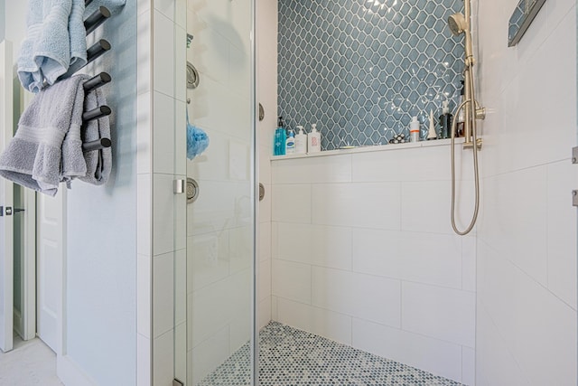 full bath with a shower stall