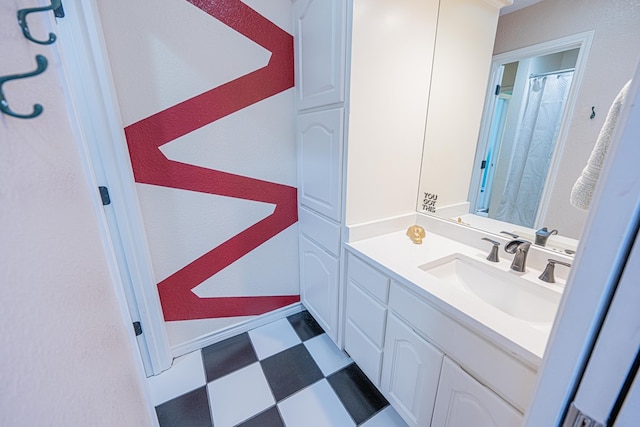 full bath with baseboards, curtained shower, vanity, and tile patterned floors