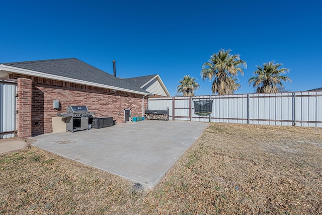 view of patio / terrace with area for grilling and a fenced backyard