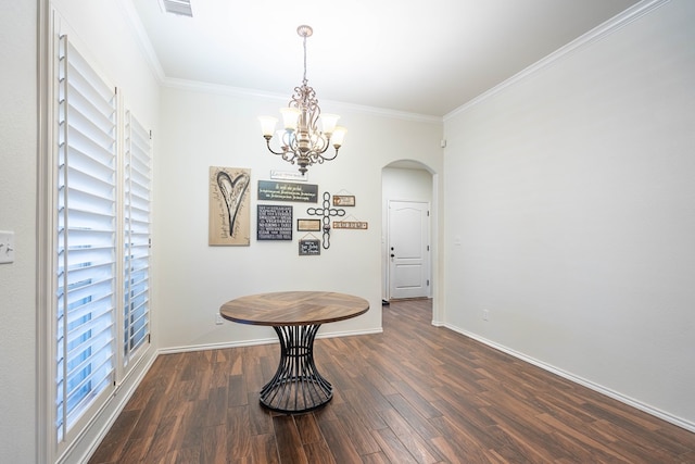 5305 Deer Run, Midland, TX 79707 - dining space featuring arched walkways, wood finished floors, crown molding, baseboards, and a chandelier