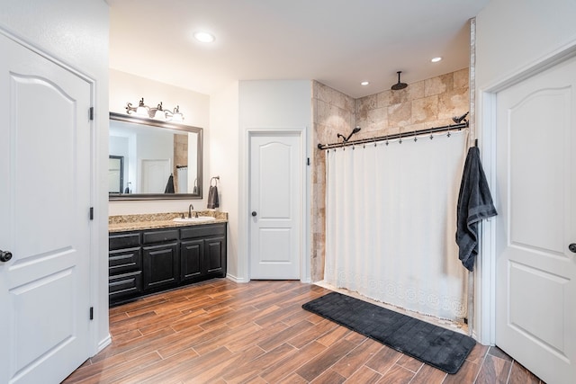 5305 Deer Run, Midland, TX 79707 - full bath with tiled shower, vanity, wood finished floors, and recessed lighting