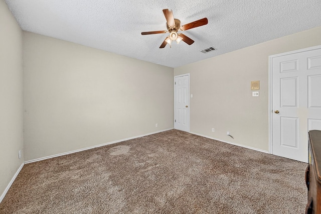 2209 Southampton Ln, Midland, TX 79705 - unfurnished room with ceiling fan, dark colored carpet, and a textured ceiling