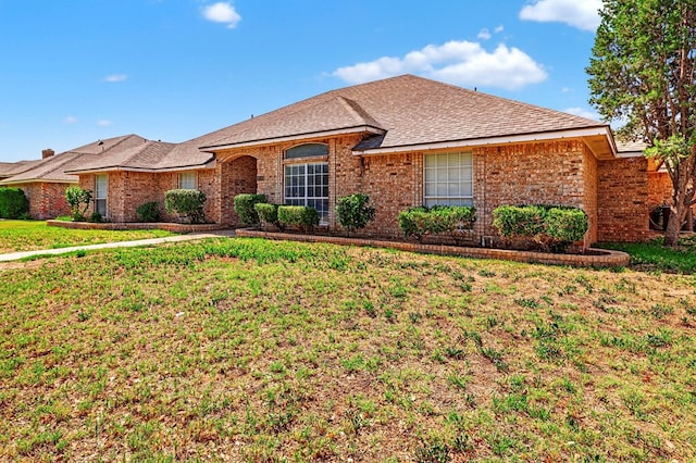 2209 Southampton Ln, Midland, TX 79705 - single story home with a front lawn, brick siding, and roof with shingles