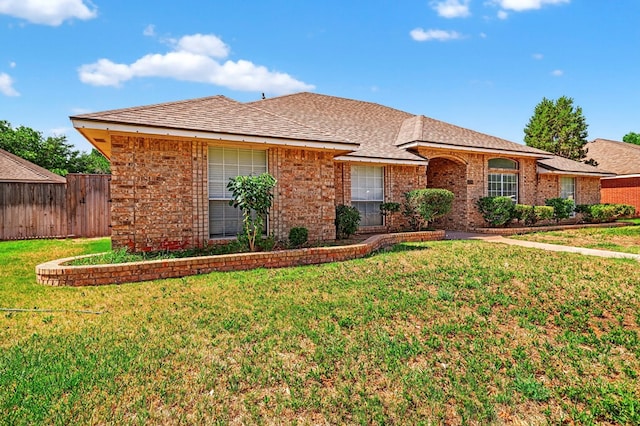 2209 Southampton Ln, Midland, TX 79705 - ranch-style home featuring brick siding and a shingled roof