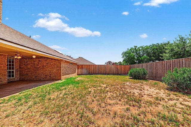 2209 Southampton Ln, Midland, TX 79705 - fenced backyard featuring ceiling fan and a patio area