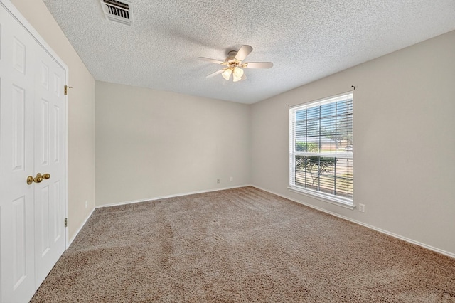 2209 Southampton Ln, Midland, TX 79705 - unfurnished bedroom with carpet flooring, a textured ceiling, and ceiling fan