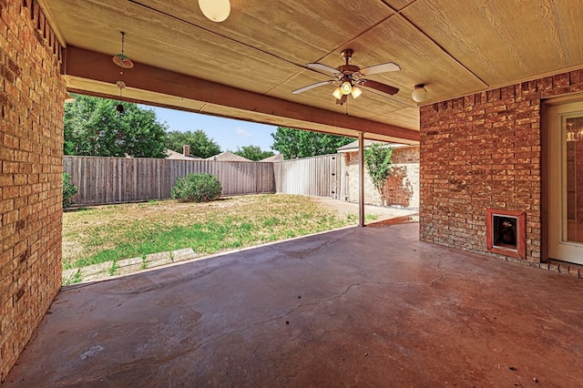2209 Southampton Ln, Midland, TX 79705 - fenced backyard featuring a patio and ceiling fan