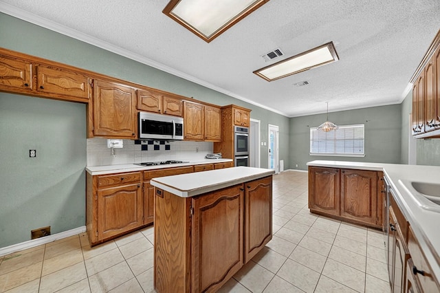 2209 Southampton Ln, Midland, TX 79705 - kitchen with appliances with stainless steel finishes, brown cabinets, a textured ceiling, light countertops, and light tile patterned floors