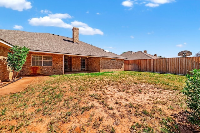 2209 Southampton Ln, Midland, TX 79705 - rear view of property with a patio area, brick siding, and a chimney