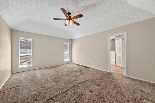 2209 Southampton Ln, Midland, TX 79705 - empty room featuring ceiling fan, carpet floors, lofted ceiling, and a textured ceiling