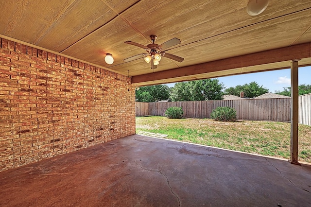 2209 Southampton Ln, Midland, TX 79705 - fenced backyard with ceiling fan and a patio area