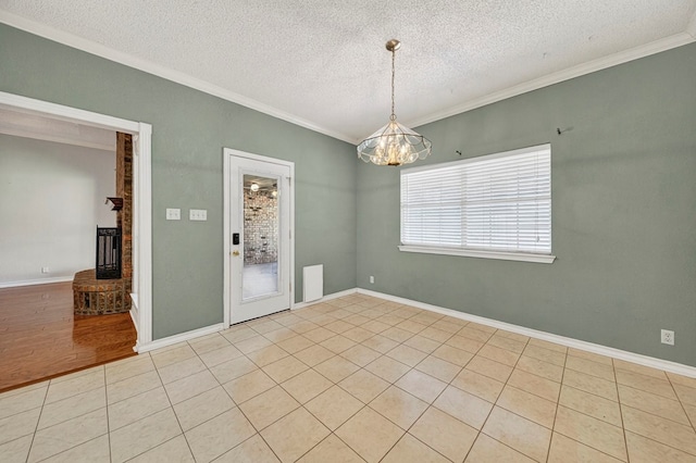 2209 Southampton Ln, Midland, TX 79705 - unfurnished room with crown molding, a chandelier, a textured ceiling, a fireplace, and light tile patterned floors