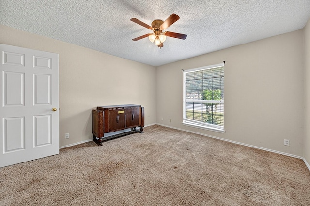 2209 Southampton Ln, Midland, TX 79705 - spare room with ceiling fan, carpet floors, and a textured ceiling