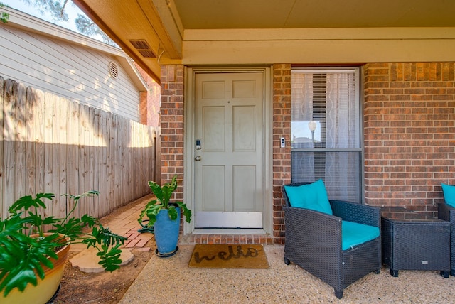 438 W Pine Ave, Midland, TX 79705 - doorway to property featuring brick siding