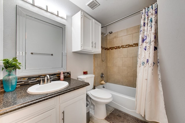 438 W Pine Ave, Midland, TX 79705 - full bath featuring vanity, shower / bath combo with shower curtain, and tile patterned flooring