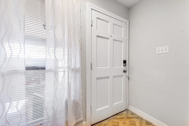 438 W Pine Ave, Midland, TX 79705 - doorway to outside featuring a textured wall