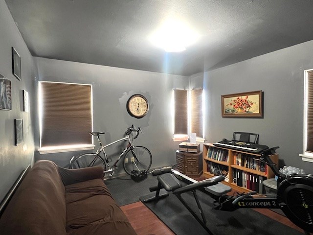 3702 Dalton Dr, Snyder, TX 79549 - exercise area featuring wood finished floors
