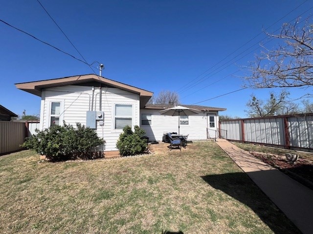 3702 Dalton Dr, Snyder, TX 79549 - rear view of property featuring fence private yard and a lawn