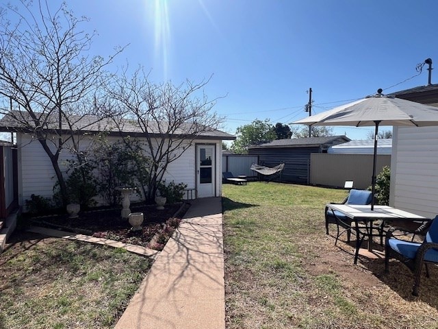 3702 Dalton Dr, Snyder, TX 79549 - view of yard featuring fence and an outdoor structure