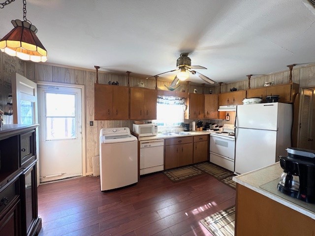 3702 Dalton Dr, Snyder, TX 79549 - kitchen with washer / dryer, under cabinet range hood, white appliances, and plenty of natural light