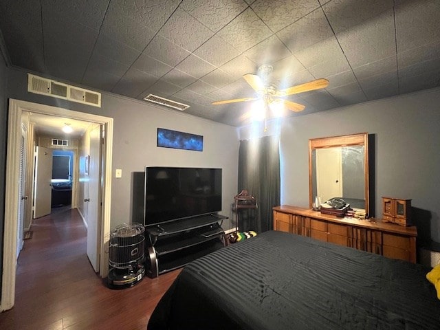 3702 Dalton Dr, Snyder, TX 79549 - bedroom with ceiling fan, wood finished floors, and visible vents