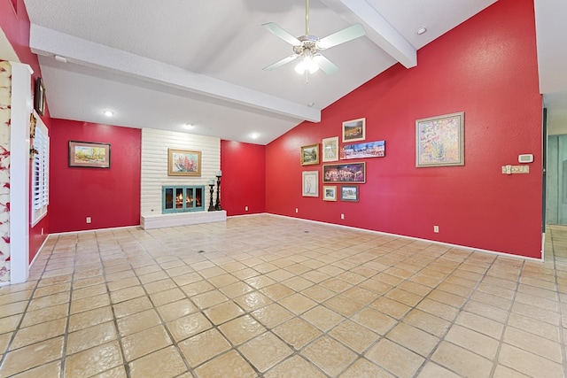 unfurnished living room featuring light tile patterned flooring, ceiling fan, a fireplace, and lofted ceiling with beams