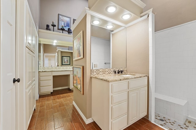 bathroom with vanity and a shower