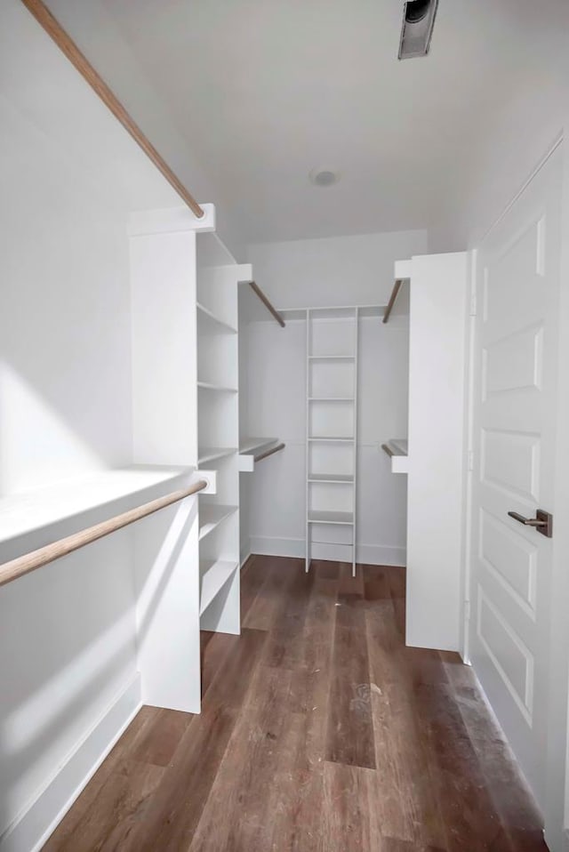 8643 Santa Isabella, Odessa, TX 79765 - walk in closet featuring dark wood finished floors