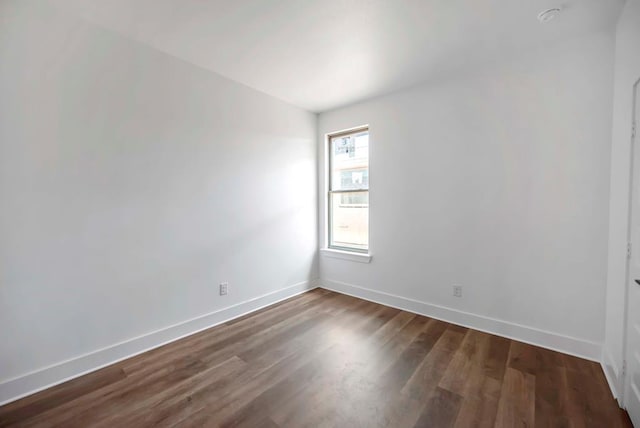 8643 Santa Isabella, Odessa, TX 79765 - unfurnished room with baseboards and dark wood-style flooring