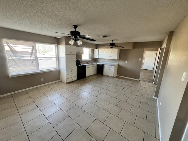 kitchen featuring white cabinets, black appliances, ceiling fan, light tile patterned floors, and a textured ceiling