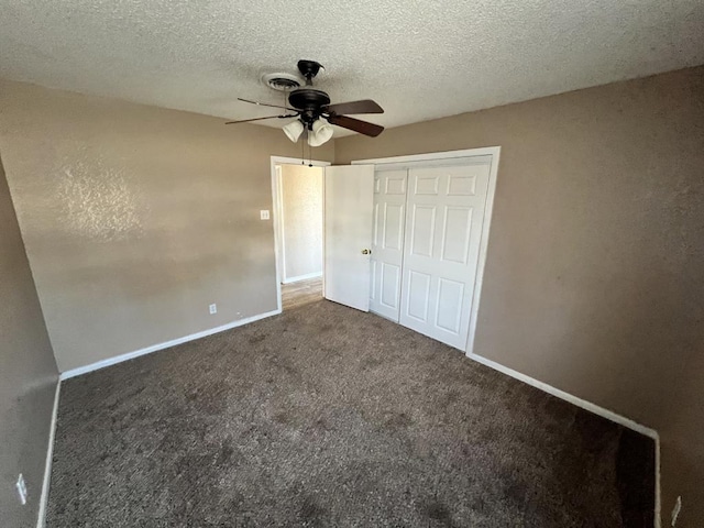 unfurnished bedroom with ceiling fan, a closet, carpet, and a textured ceiling