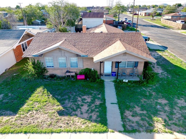 ranch-style home with a front yard