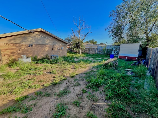 view of yard with central AC