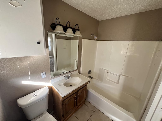 full bathroom with shower / bathing tub combination, vanity, tile patterned flooring, toilet, and a textured ceiling