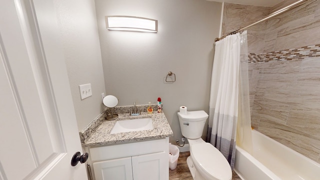 bathroom with vanity, toilet, and shower / bath combo with shower curtain