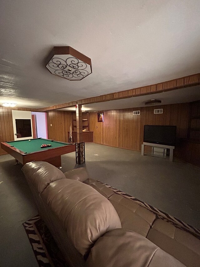 recreation room with carpet flooring, wooden walls, and pool table