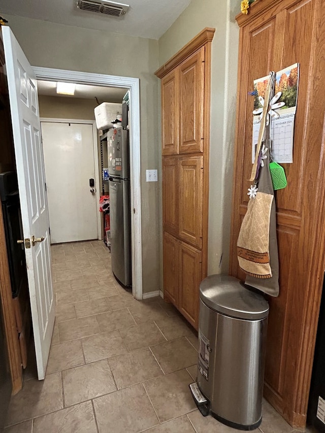 interior space with stainless steel refrigerator