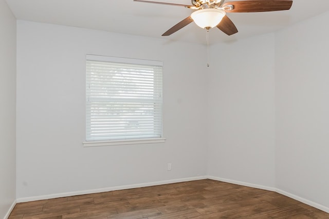 unfurnished room featuring dark hardwood / wood-style floors and ceiling fan