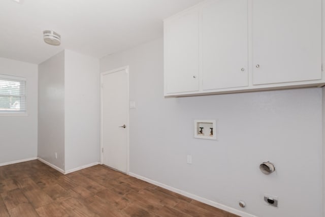 laundry area featuring hookup for an electric dryer, hookup for a washing machine, dark hardwood / wood-style floors, and cabinets