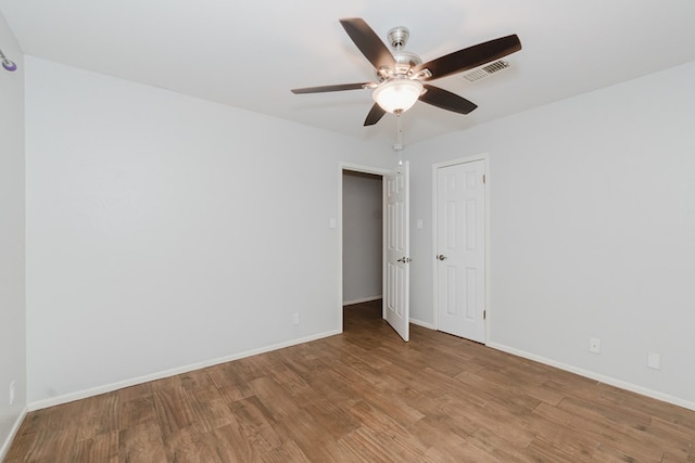 empty room with light wood-type flooring and ceiling fan