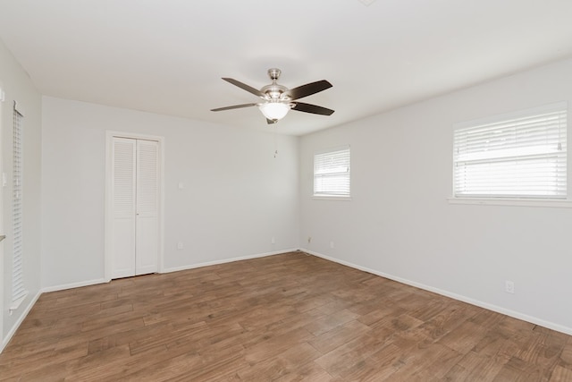 unfurnished bedroom with hardwood / wood-style flooring and ceiling fan