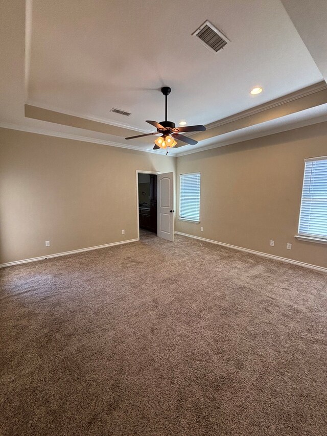 4304 San Pedro Ct, Midland, TX 79707 - unfurnished bedroom featuring visible vents, ornamental molding, baseboards, and a tray ceiling