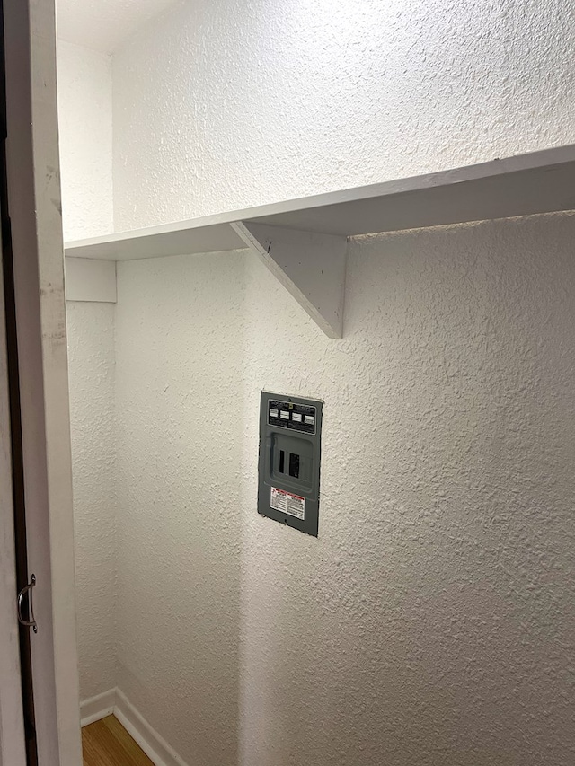 washroom featuring baseboards and wood finished floors