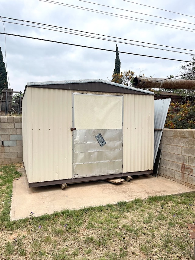 view of shed with fence