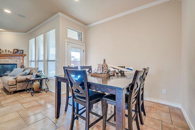 dining room featuring light tile patterned flooring and crown molding