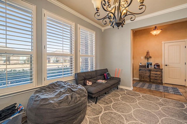 living room with an inviting chandelier and crown molding