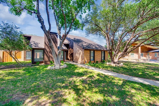 4106 Dyer Cir, Midland, TX 79707 - view of front of house with a front lawn and brick siding