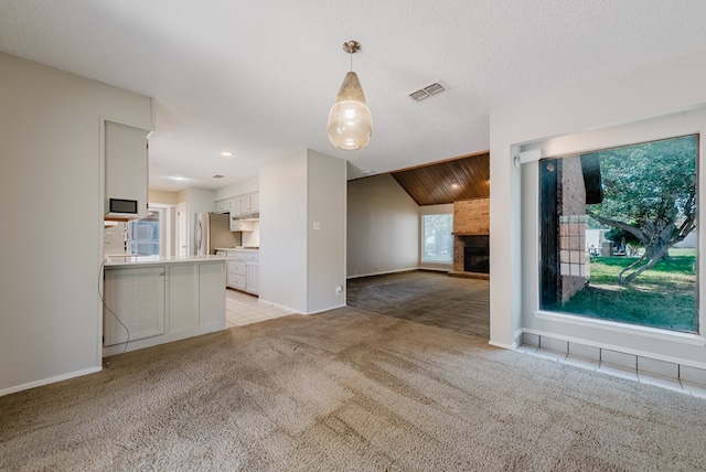 4106 Dyer Cir, Midland, TX 79707 - unfurnished living room featuring baseboards, light carpet, a brick fireplace, and visible vents
